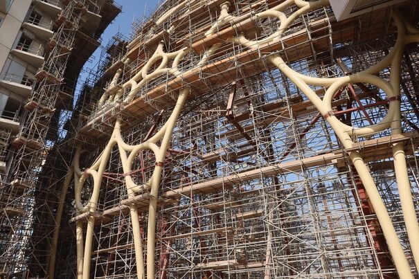 intricate building with scaffolding around the structure